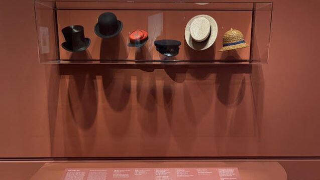 hats on display at an art exhibit