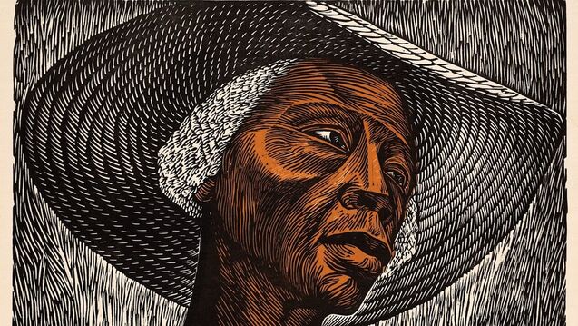A color linocut portrait of a woman wearing a wide-brimmed hat. Her face, rendered in warm brown and black tones, is illuminated from above, showing strong carved lines that define her features and texture. The background and hat are filled with rhythmic, curved strokes, creating movement around her calm, introspective expression.