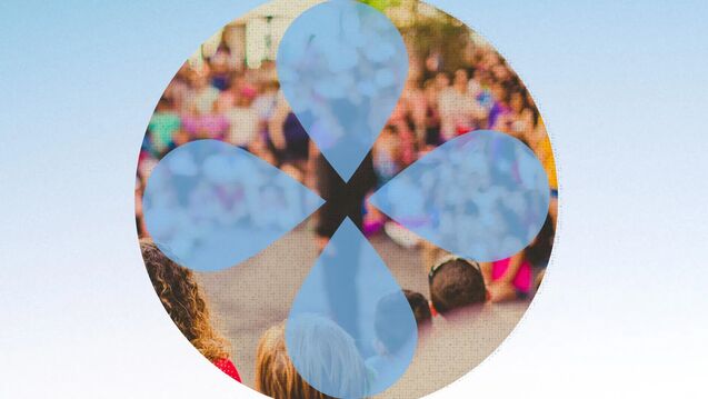 Circular graphic with a blurred outdoor crowd scene visible through a beige circle. Four large blue droplet shapes form a clover-like cutout over the image.