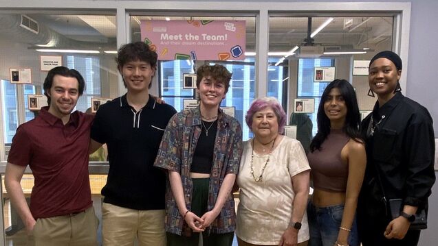 Members of the AIGA stand outside the VisCom department.