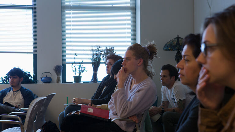 An image of a large, group of students sitting in a classroom. 