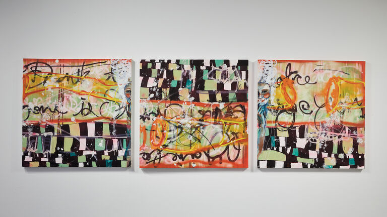 Three square paintings using a black checkered pattern over orange, yellow and green writing and abstract shapes.  