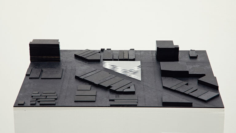 An architectural model using black and clear material.   