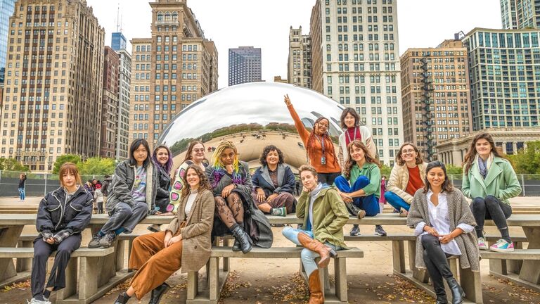 Alt text: Arts Admin students sitting in front of Cloud Gate (The Bean)