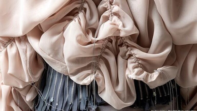 fabric intricately draped and sown