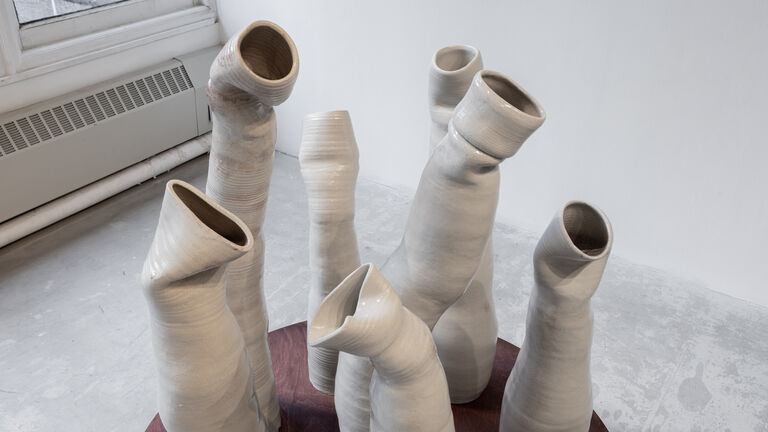A series of tall ceramic stalks Image credit: Audrey Mullin
