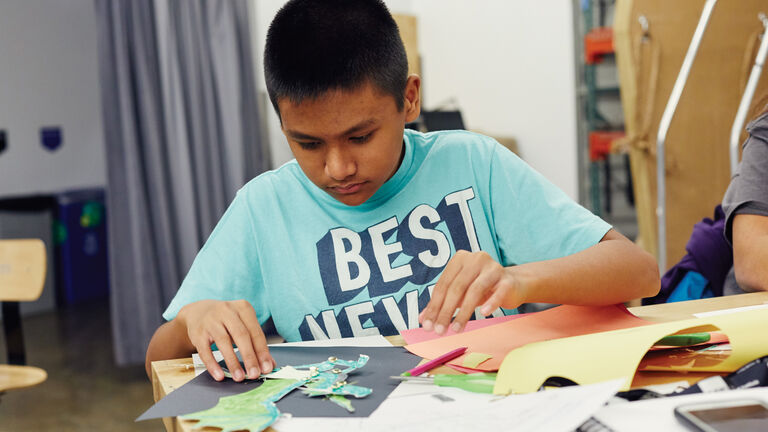 A student works on a collage work