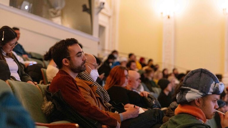 Audience listening to Whitaker Malem Lecture in the Art Institute of Chicago Fullerton Hall