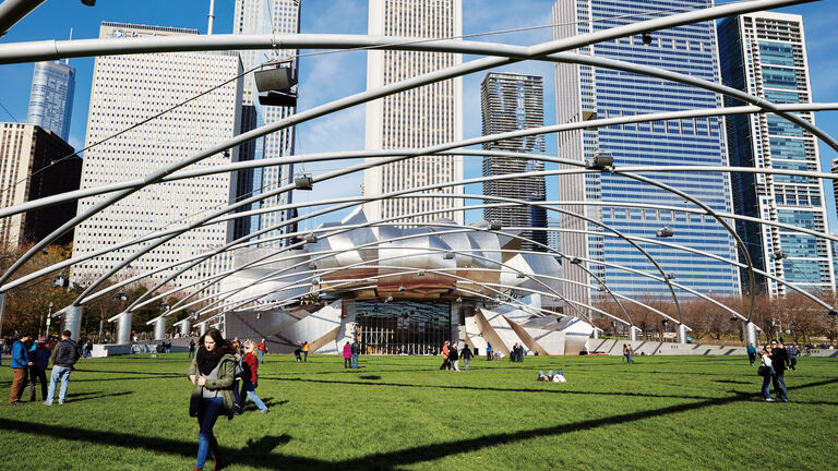 Millennium Park amphitheater surrounded by skyscrapers.