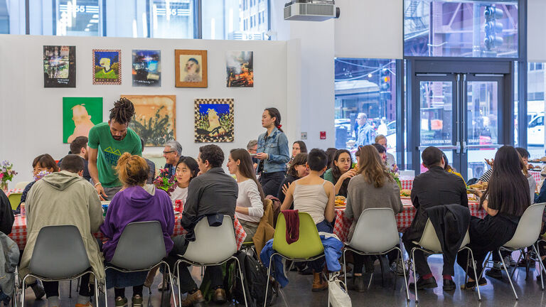 A large group of students sitting at a table together. 