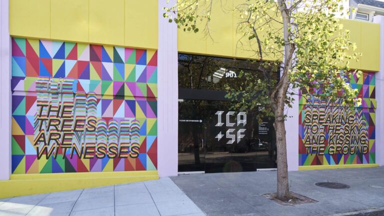 The yellow exterior of a modern art museum