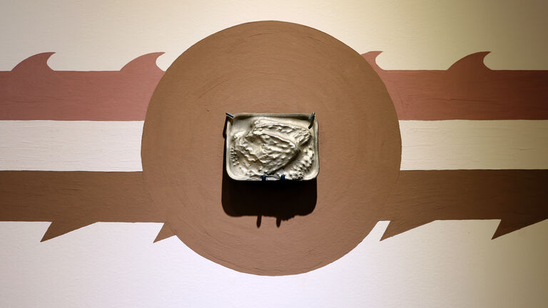 A sculpture installation against a wall