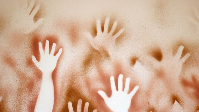 Hands painted on a wall 