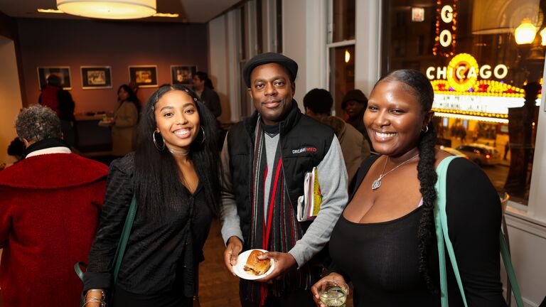 SAIC students Saida Blair and Jordan Barrant pose with visitor at Cry of Jazz event at Gene Siskal Film Center.