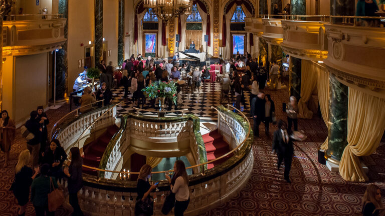 Dimly-lit and populated ballroom