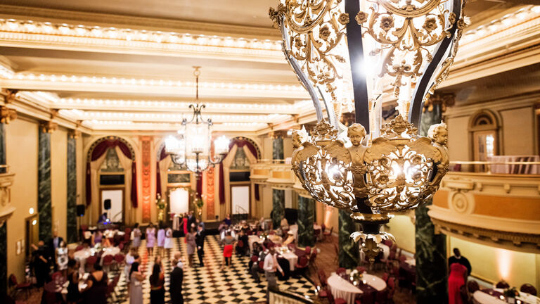 Well-lit and populated ballroom