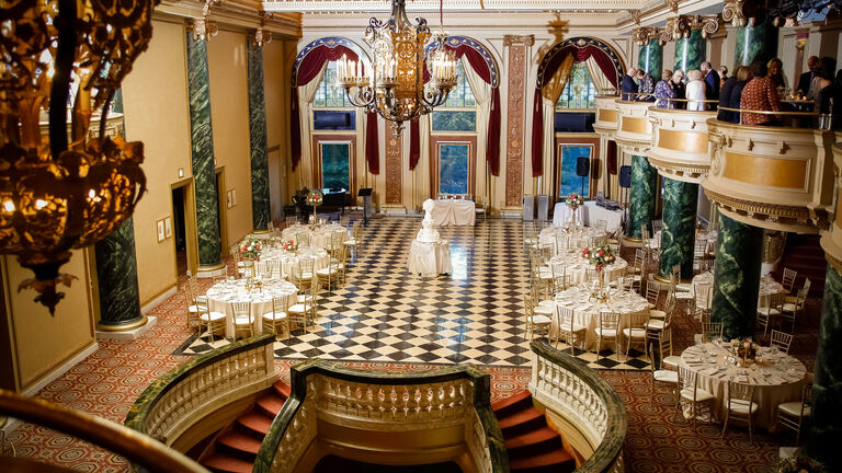 Well-lit, vacant, and furnished ballroom