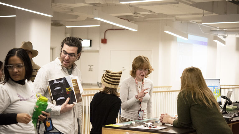 People conversing in a library