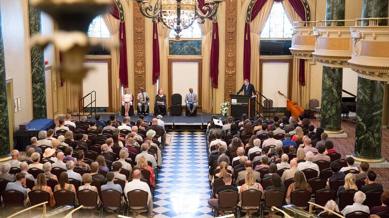 Graduation ceremony taking place in a ballroom