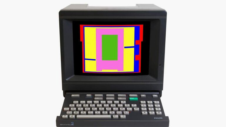 Old computer with various colorful shapes on it