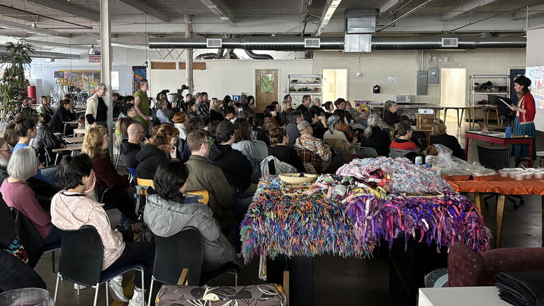 Large audience at Emily Winter's lecture at the Weaving Mill.