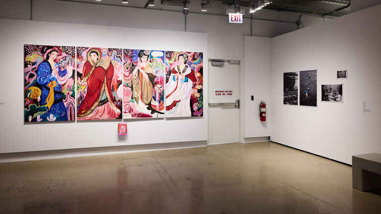 Four vertical paintings hanging next to each other featuring women in different poses.