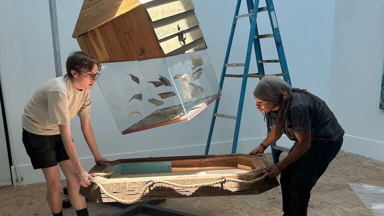 students installing a scuplture