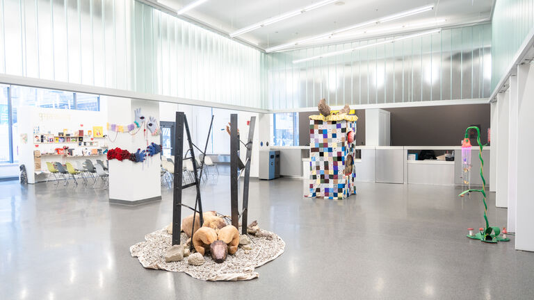 A modern gallery space with different multimedia work installed