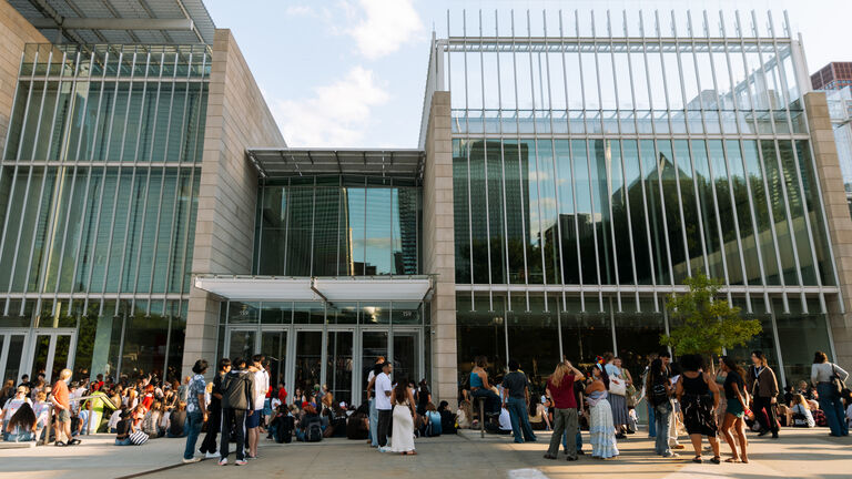 Students of varying ethnicities, ages, and genders on the museum campus.