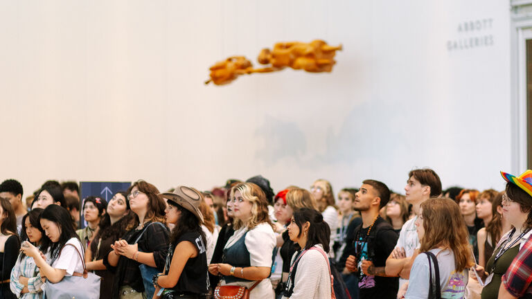 Students of varying ethnicities, ages, and genders gather in the Art Institute.