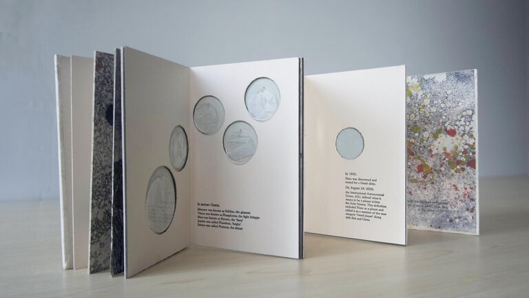 A book with circles printed on the pages.