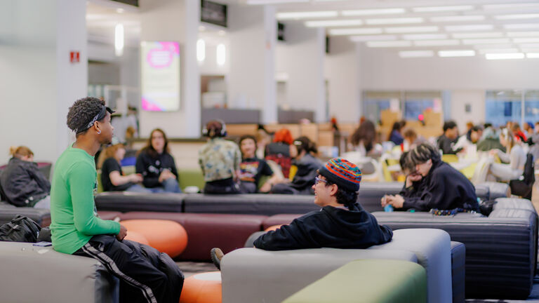 A group of students relax in a student center