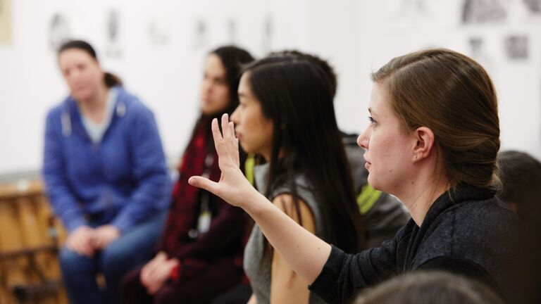 A group of students speaking.