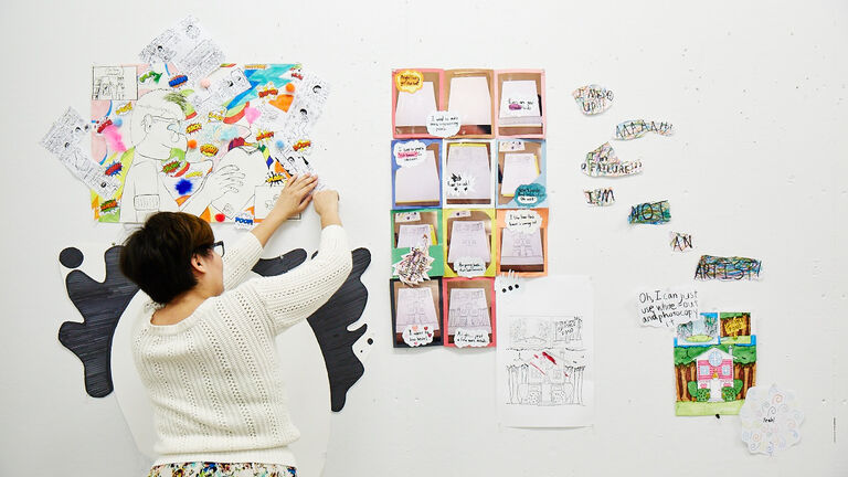 Student works on wall project
