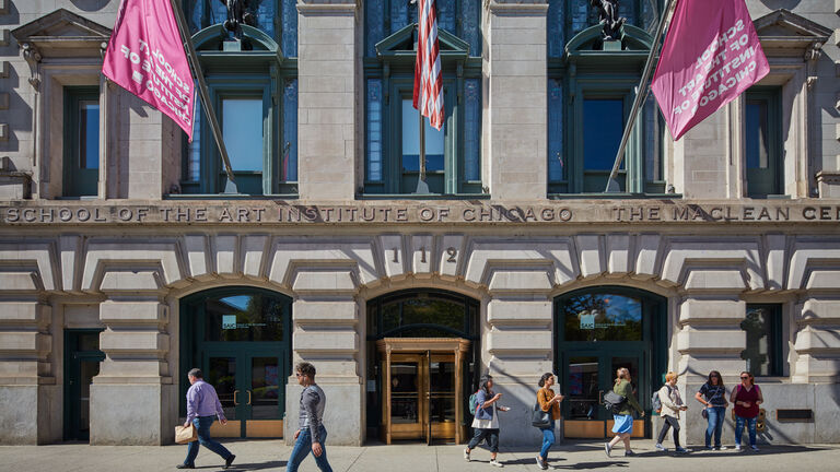 Exterior of SAIC with people walking