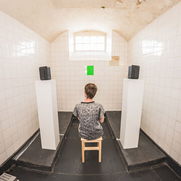 Kim Walker installation of a woman in a confined space.