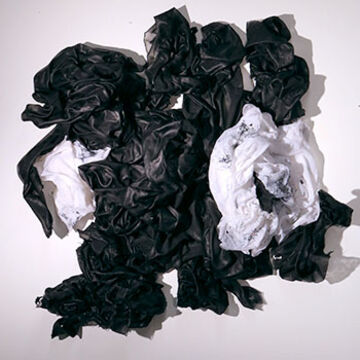 Images of crumpled black and white fabric