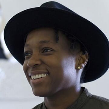 An image of Ayanah Moor wearing a black hat.