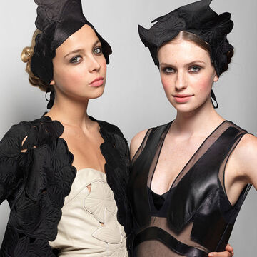 Two models wearing Gemma Kahng's designs. 