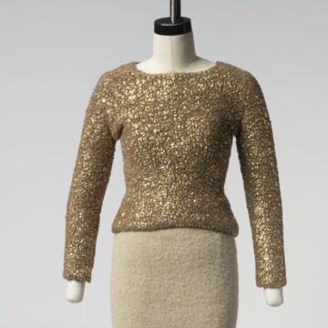 Knit camel wool pullover sweater with a gold crackled surface paired with a Baby Alpaca, woven, straight knee-length skirt.