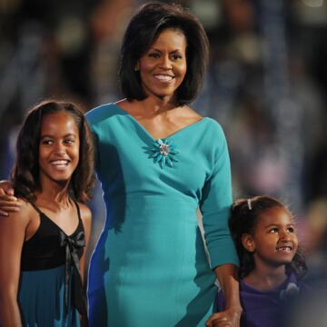 An image of Michelle Obama in a blue dress designed by Maria Pinto. 