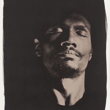 A Vandyke print of a person with their eyes closed.