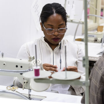 A student works with a sewing machine at the FSC