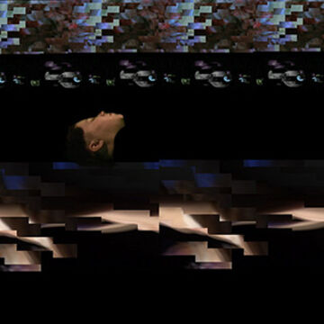 A glitched-out image of a person lying down