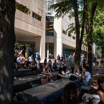 A large group of students congregate in the pit outside 280
