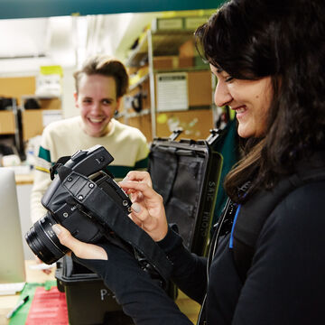 A student checks out a medium format camera