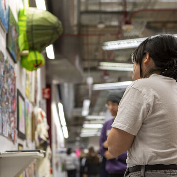 Students observe work by their fellows at Artbash