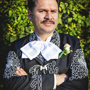 A person in an ornate suit.