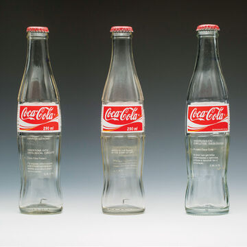 Three Coca-Cola cans 