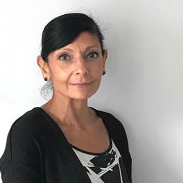 A headshot of Anita Bhardwaj wearing a black top. 